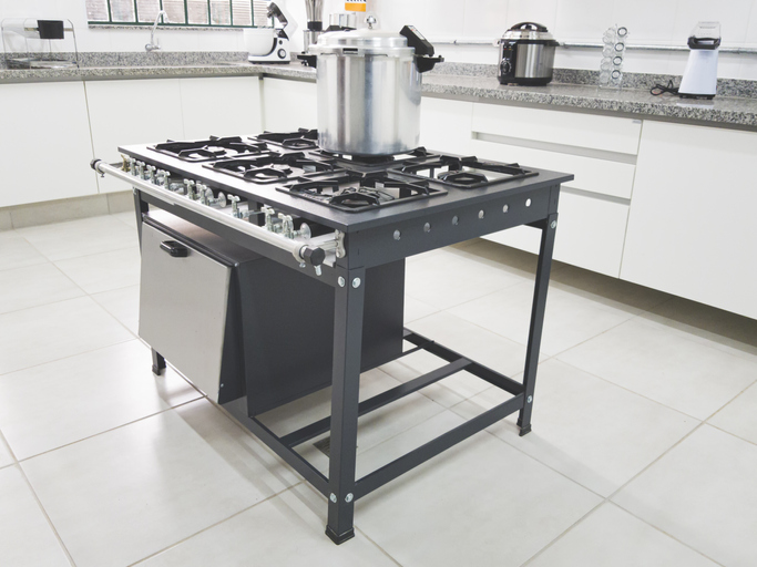 Photo of a industrial stove in a kitchen of a restaurant.